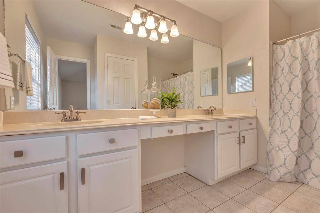Primary bathroom with dual sinks.
