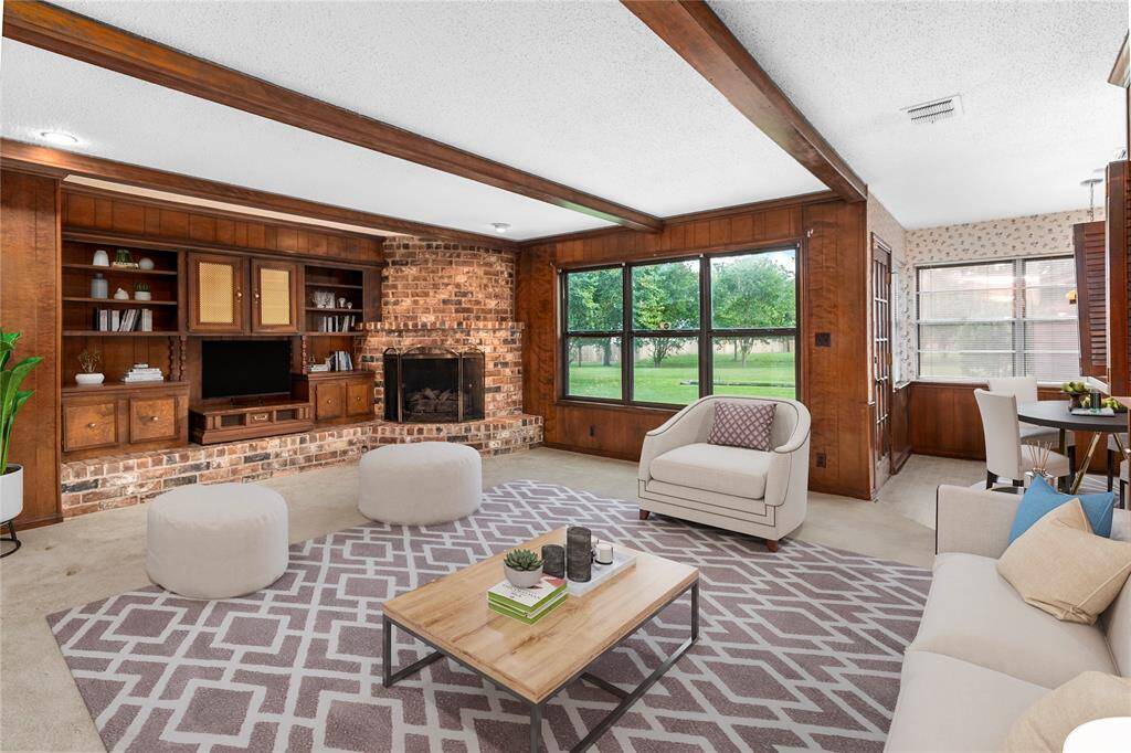 VIRTUALLY STAGED PHOTO! Family Room w/Wood-burning Fireplace! Beamed Ceiling & Built-in Cabinets! View of Park-like Backyard! French Door to Patio! Connects to Breakfast Room!