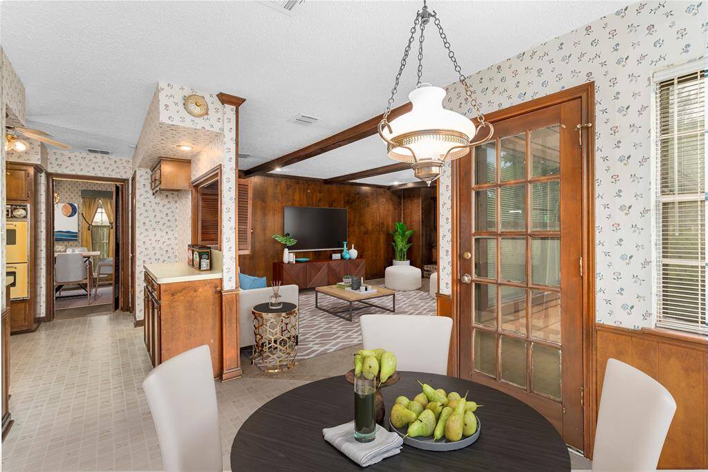 VIRTUALLY STAGED PHOTO! Breakfast Room w/French Door access to Back Patio! Connects to Kitchen & Family Room! Formal Dining Room through the Kitchen! Laundry Room & Guest Bath to the LEFT!