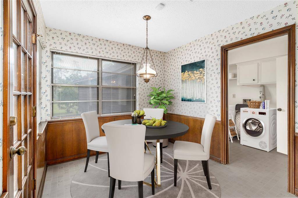 VIRTUALLY STAGED PHOTO! Breakfast Room w/French Door access to Back Patio! View of Park-like Backyard! Connects to Kitchen & Family Room! Laundry Room & Guest Bath to the RIGHT!
