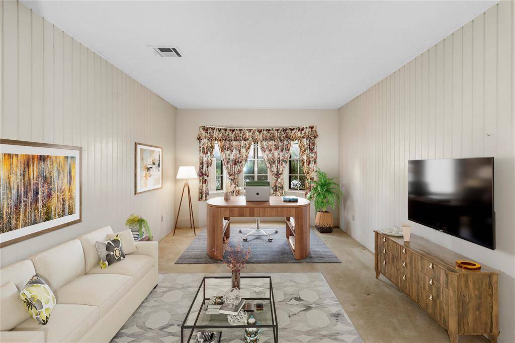 VIRTUALLY STAGED PHOTO! Extra Room next to Entry Hall & Owner's Suite! Could be used as a Study, Extra Bedroom, Game Room...YOU DECIDE! Bay Window w/View of Lushly Landscaped Front Yard!