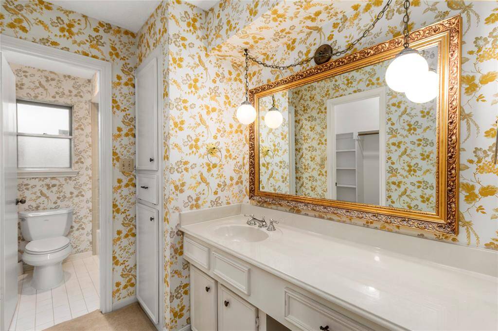 Owner's Ensuite Bath w/Large Counter & Vanity Seating Area! Could be converted to Double Sinks! Built-in Cabinets! Walk-in Closet to the LEFT!