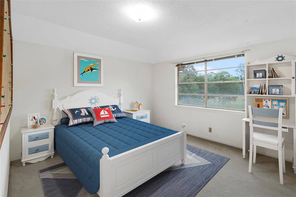 VIRTUALLY STAGED PHOTO! Large Bedroom #2 with view of the Park-like Backyard! All Bedrooms have Walk-in Closets!