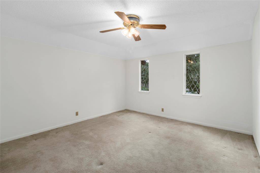 EXTRA LARGE Bedroom #4 with view of the Lushly Landscaped Front Yard! Large enough to be a Theater Room or Game Room! Leaded Glass crank-open Windows! All Bedrooms have Walk-in Closets!