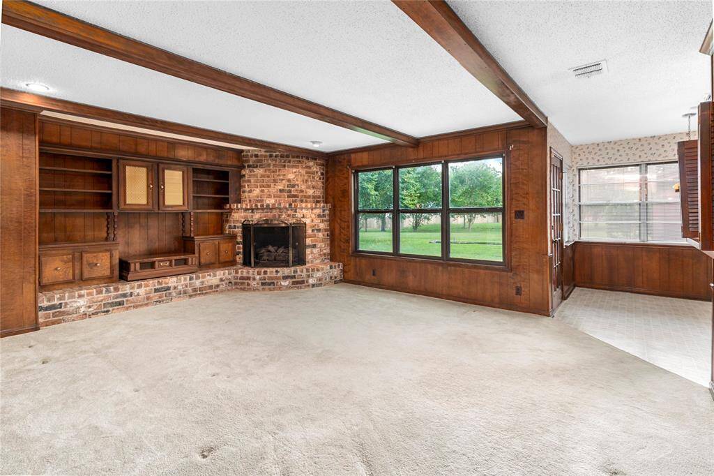 Family Room w/Wood-burning Fireplace! Beamed Ceiling & Built-in Cabinets! View of Park-like Backyard! French Door to Patio! Connects to Breakfast Room!