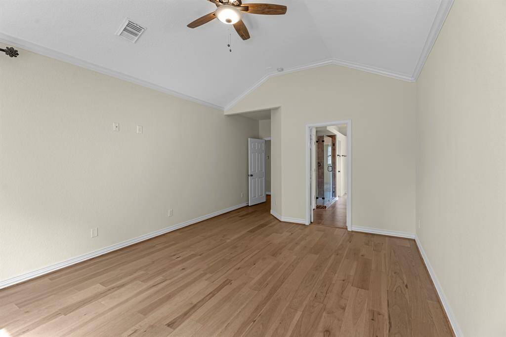 Another view of primary bedroom