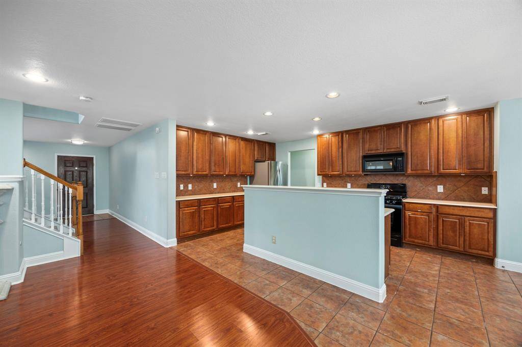 Plenty of cabinets in the kitchen for all your kitchen needs.