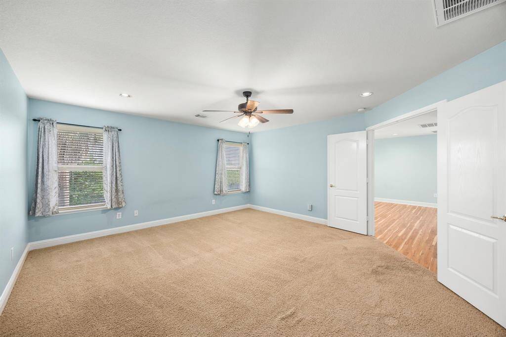 View towards the double door entry of primary suite and Gameroom.