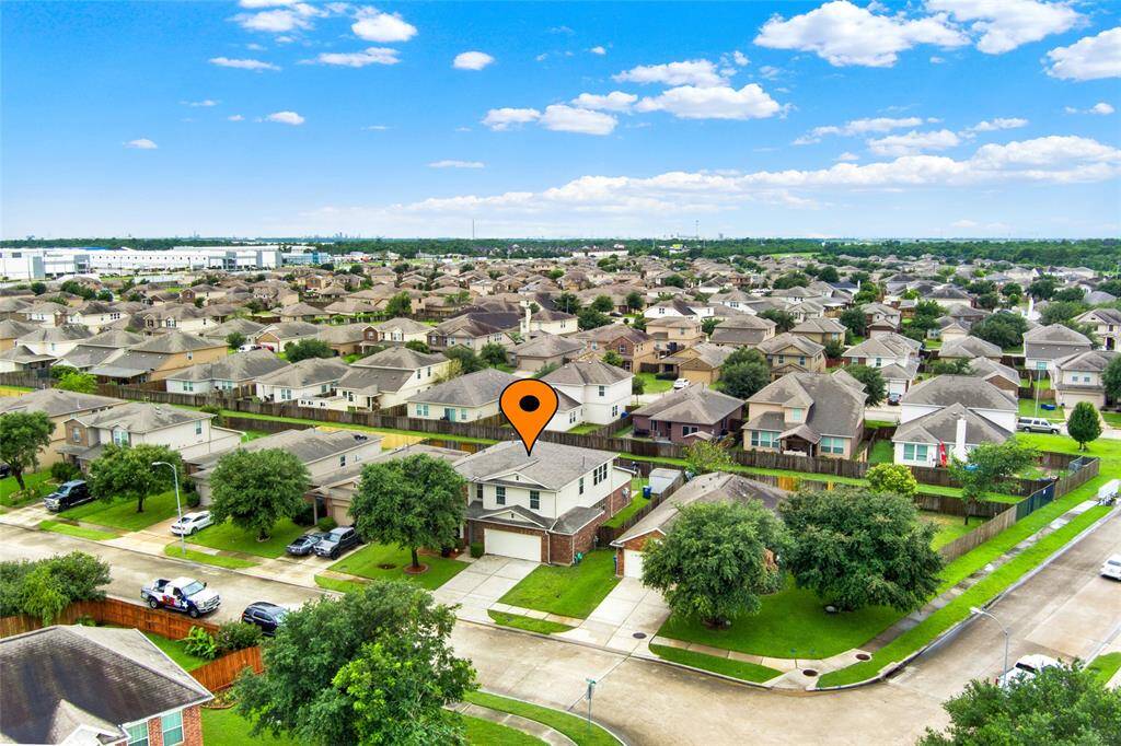 Discover your perfect corner retreat in this serene suburban oasis, marked by an orange pin. This two-story gem boasts a generous yard amidst a vibrant community dotted with leafy green spaces.