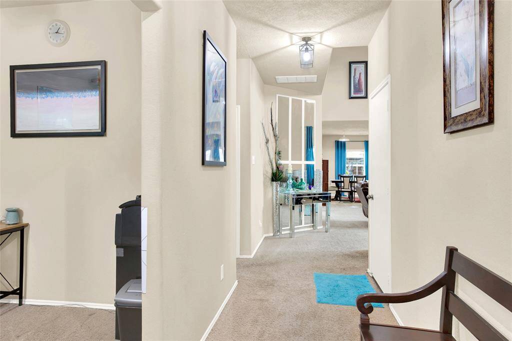 Bask in the natural light of this inviting entryway, which seamlessly flows into a generous, open-concept living space, perfect for modern living.