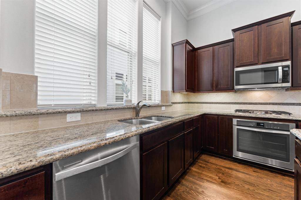 Modern stainless steel appliances included with the home.