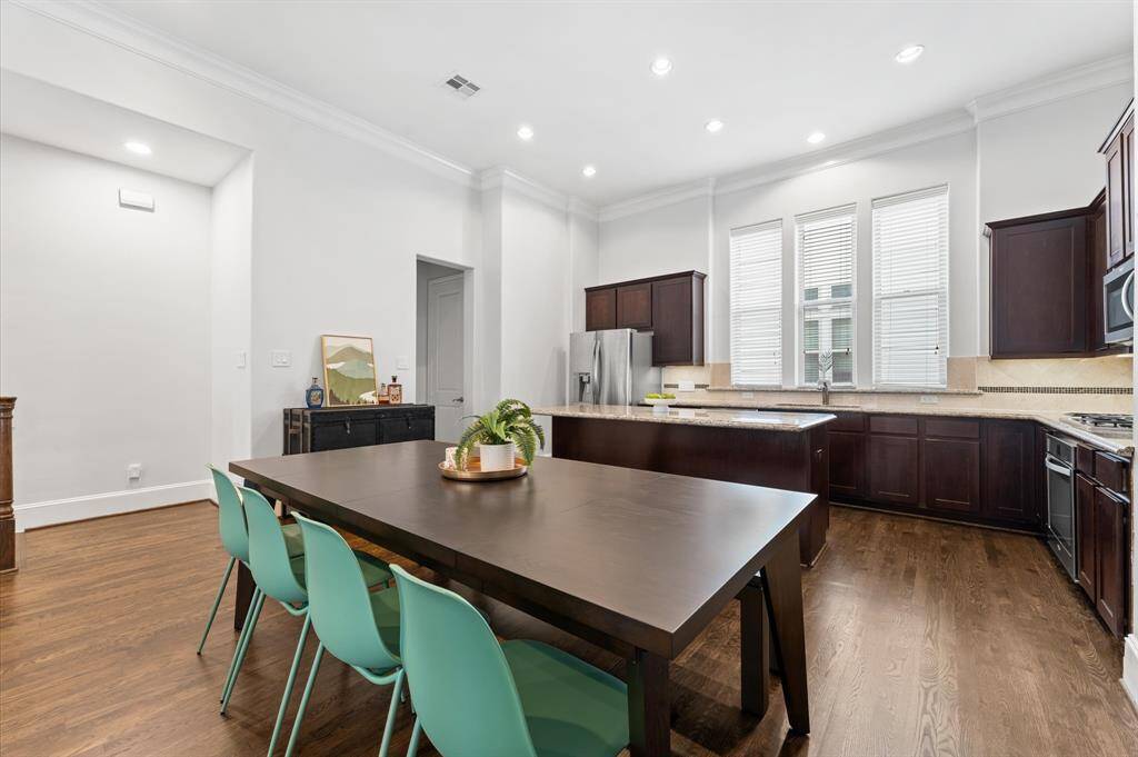 Open-concept dining area seamlessly connects to the kitchen and living space.