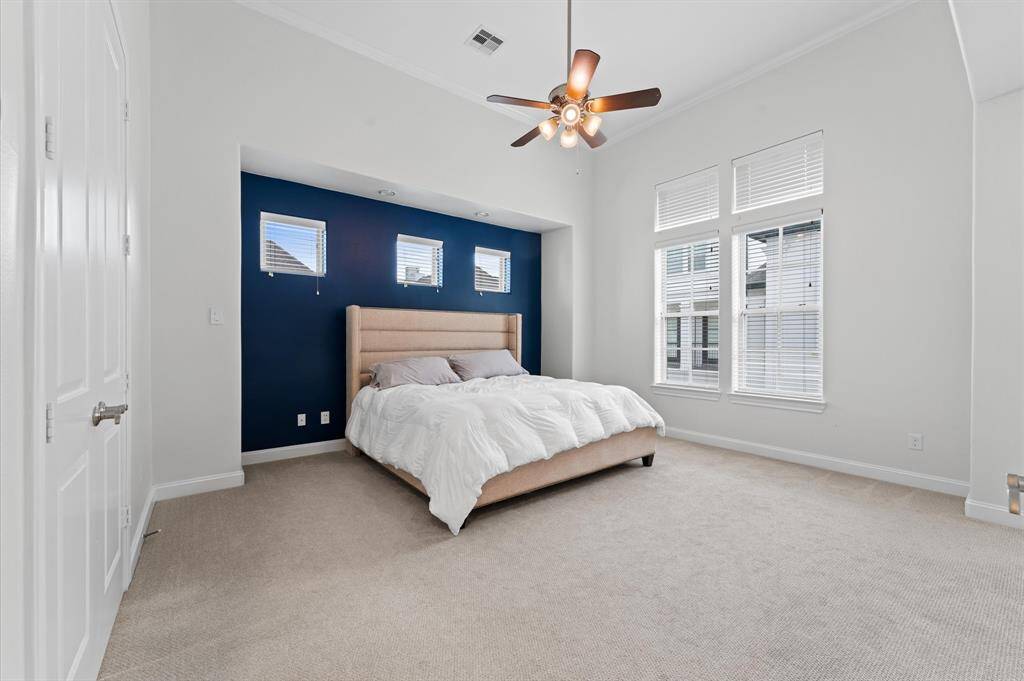 Oversized primary suite with dual walk-in closets.