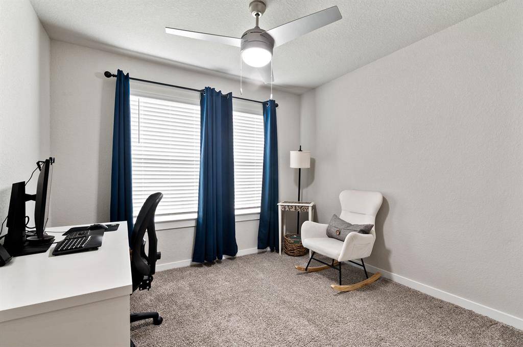 This split floor plan offers three generously sized secondary bedrooms, each with large windows that bring in natural light.