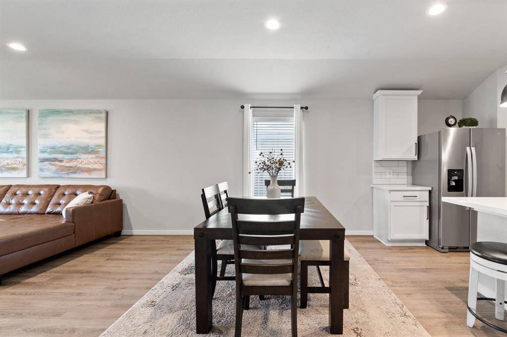 The open dining area offers a bright and welcoming space that flows seamlessly from the kitchen, perfect for both casual meals and formal gatherings.