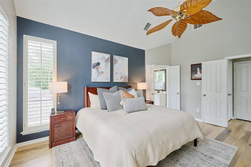 The light and bright Primary Bath has been beautifully updated with quartz countertops, a generous sized shower, and soaking tub.