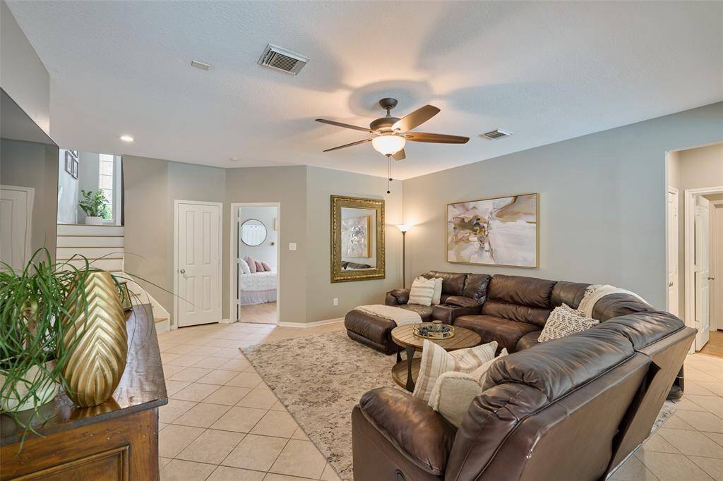 One of the five bedrooms with views of the front yard.