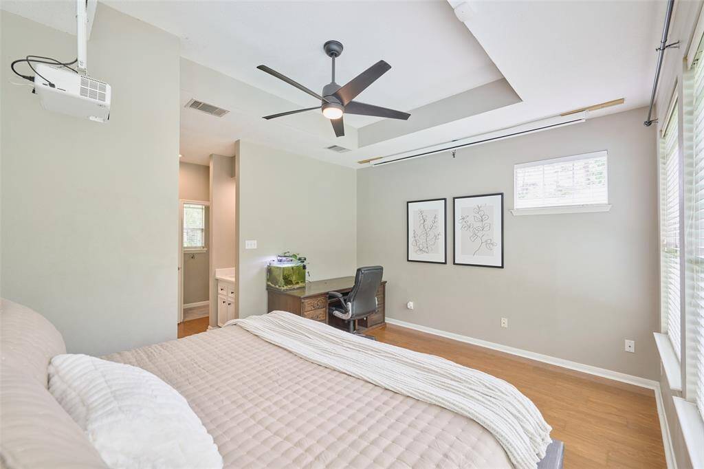 The guest suite has a walk-in closet and sink outside of the shower area.