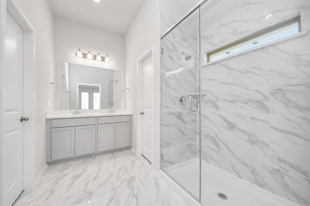 Standing Shower, dual vanities with modern finishes