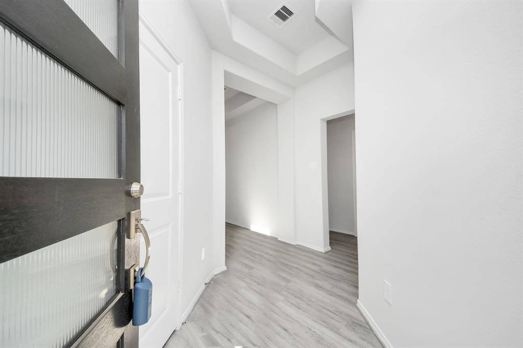 Beautiful Modern door opens up to Foyer
