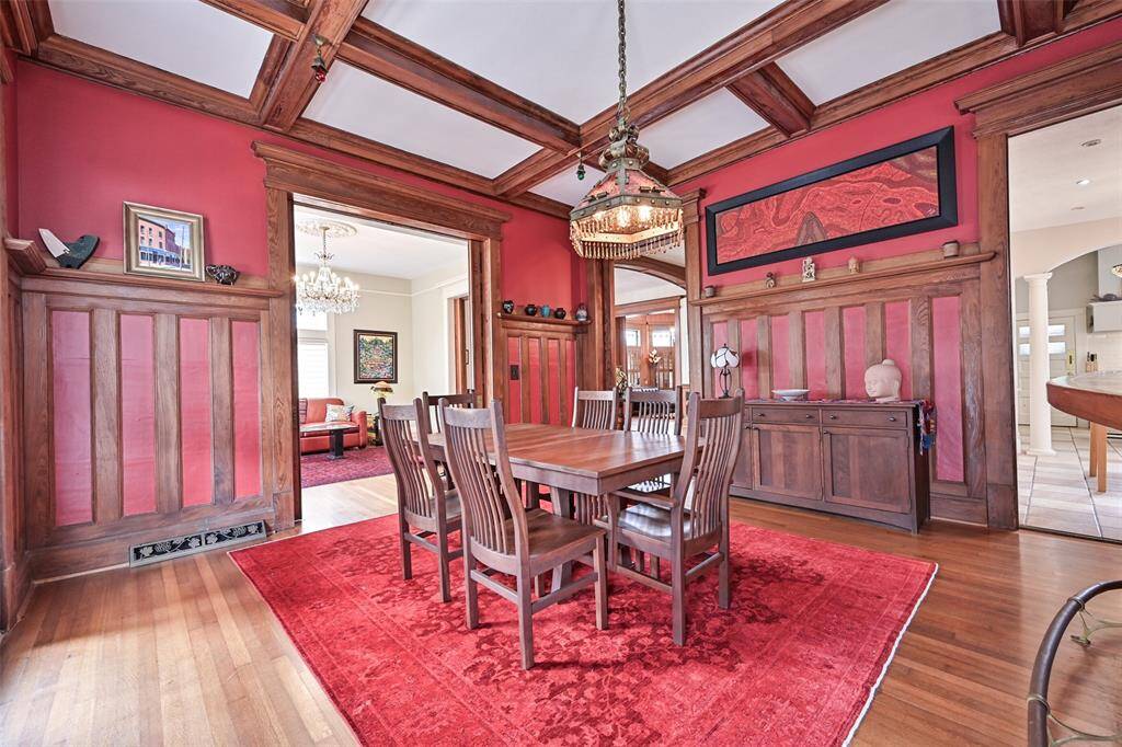 Easy Access from Both the Formal Living Room and Kitchen - the Entertaining Flow is Stellar! Beamed Ceiling and Block Paneling with Original HVAC Decorative Grating is so Pretty!