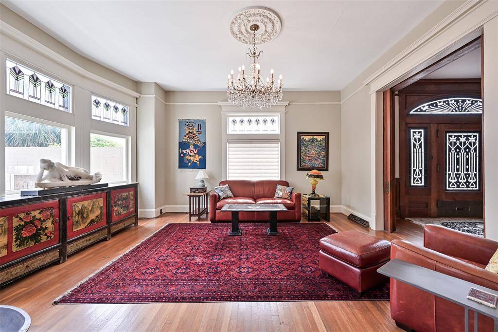 Every Room has Beautiful Original Wood Floors, Enormous Windows for Light Filled Rooms, Block Wood Paneling and Original Custom Trim Package/Moldings! Fabulous Chandeliers and Lighting Throughout the Home!