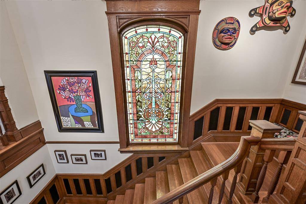 This Stained-Glass Window is Back Lit, and it Glows with Gorgeous Colors! The Entire Main Staircase is Very Grand.
