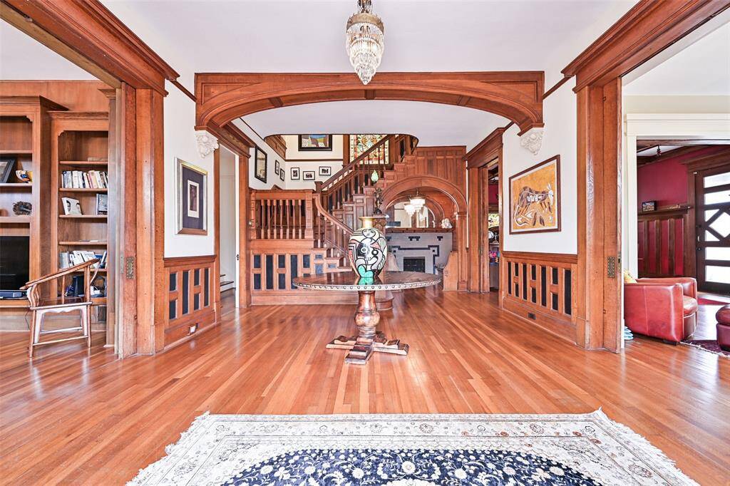A Proper Greeting in this Massive Foyer, Leading to Important Communal Areas for Entertaining Flow.  Flexible Spaces for the Ability to Re-Define Rooms to Suit Personal Preference! Note the Enormous Pocket Doors for   Space Separation into More Private Areas!