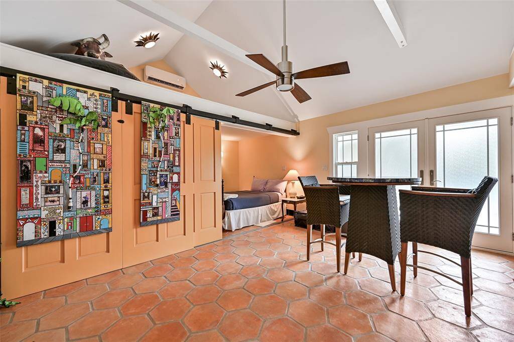 A Large Bedroom Area is Located Behind the Series of Sliding Doors in the Pool Cabana for Family or Guests Needing Their Own Special Space! There are Two Loft Areas Above that can be accessed with Ladders not currently located in the Pool Cabana.