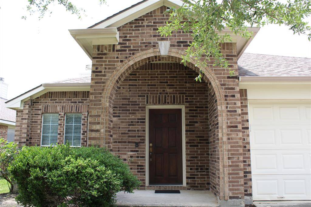 Covered arched porch is elegant and inviting.