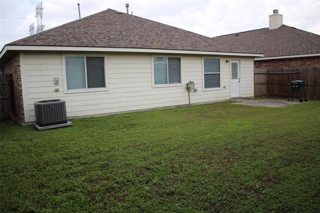 Large fully fenced back yard with patio.