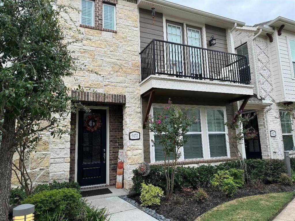 View of this two story TH with brick, stone and hardy plank. HOA maintains the front yard.
