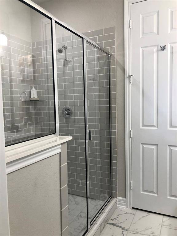 Double sink vanity in master bathroom.