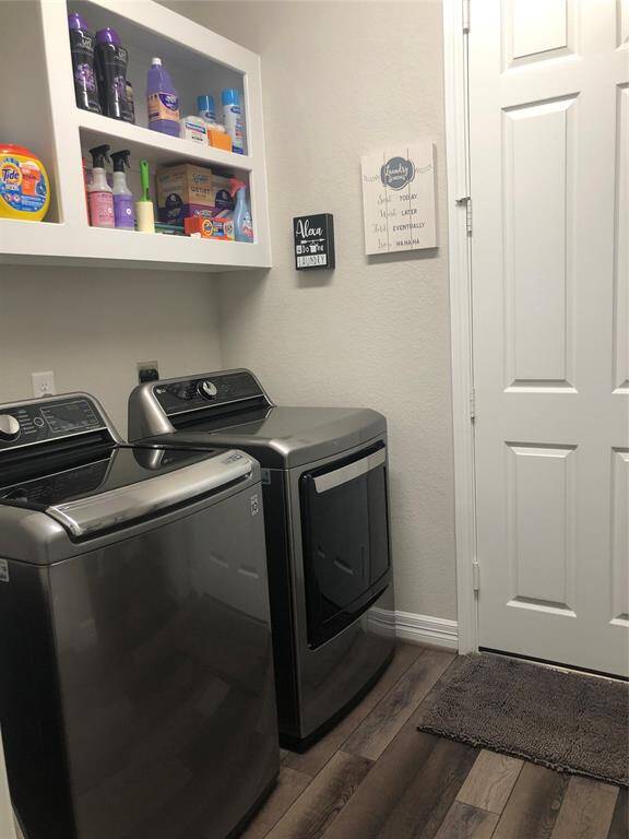 Laundry room off the garage with a closet and extra storage space.