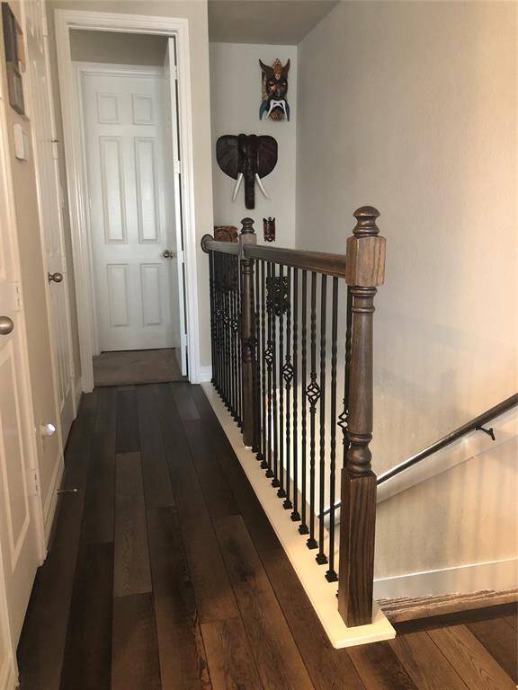 Hall way upstairs with a extra closet and half bath.