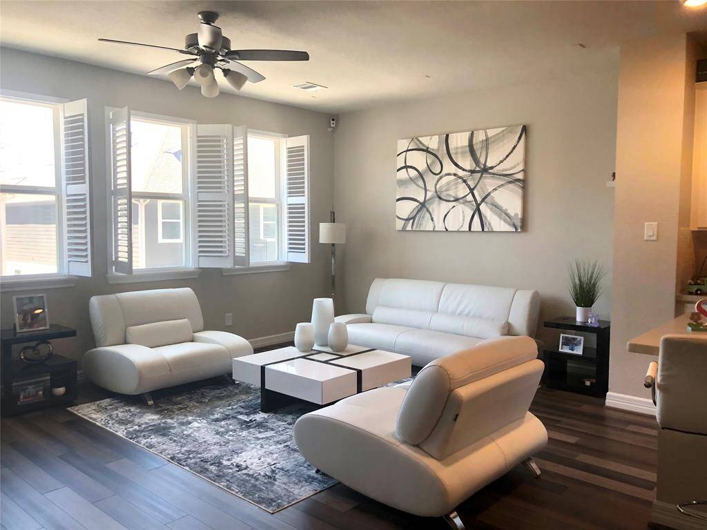 Living room with lots of light and interior white shutters.