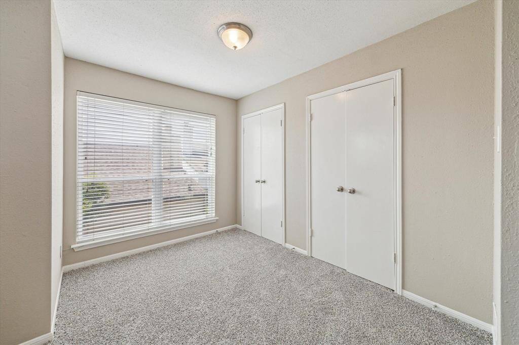 A closer look to the additional space in the primary suite. There is a wall closet in this area, and there is an additional walk in closet in the primary bathroom space.