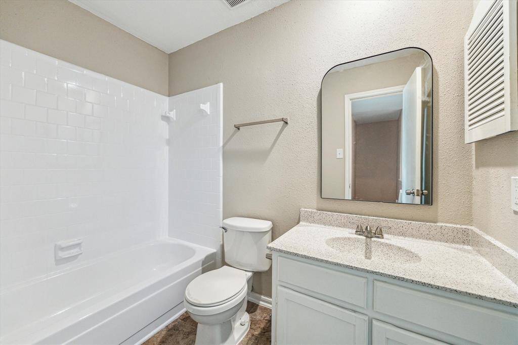 There is a full secondary bath on the second level at the end of the staircase.