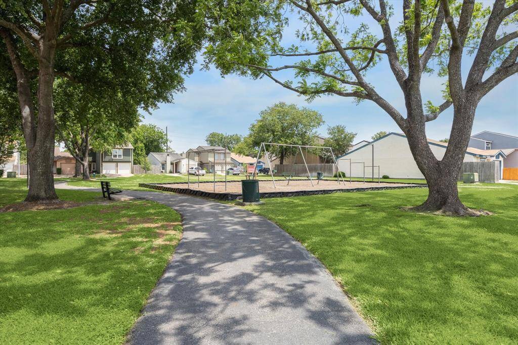 Exceptional corner lot with direct views of the playground and tennis courts.