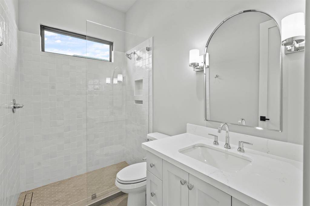 This bright hall bath serves the bedroom and game room!