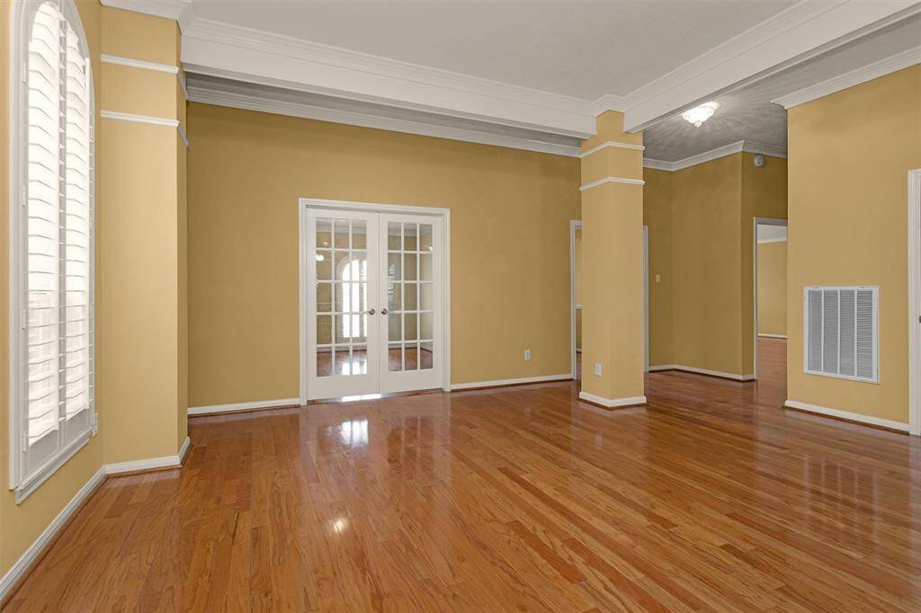 A private Home Office sits behind French Doors!