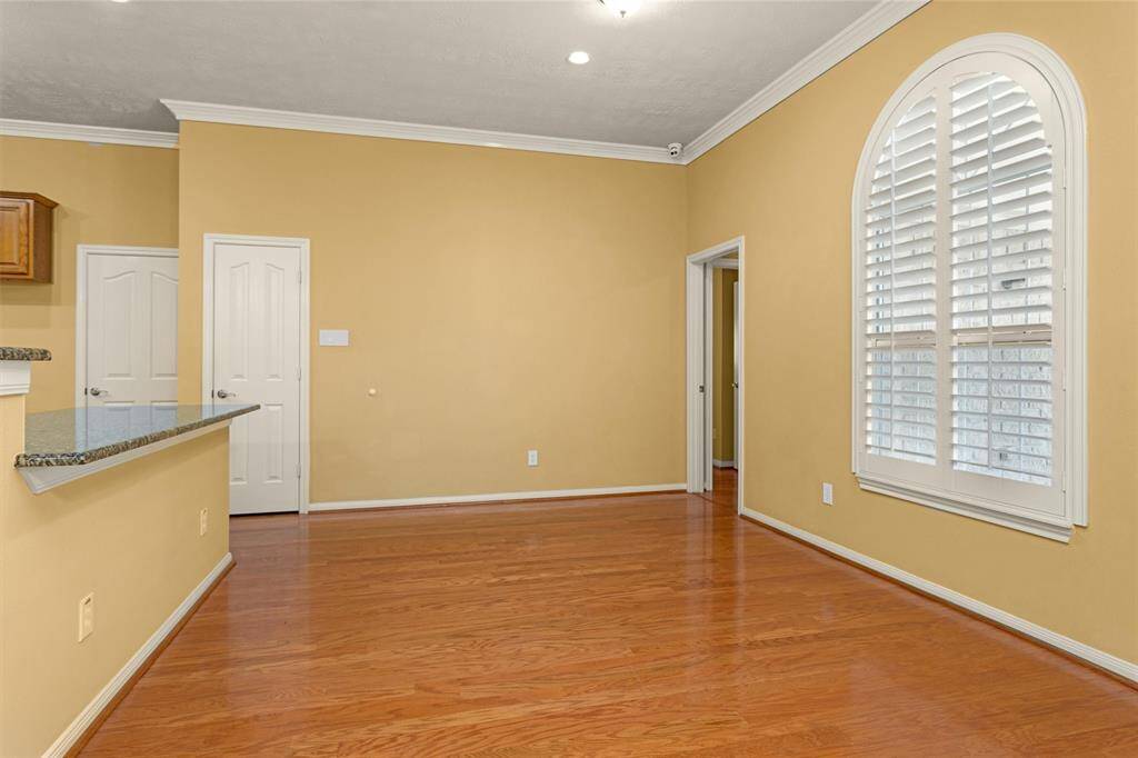 Breakfast Nook off the Kitchen is perfect for enjoying everyday meals and features a beautiful arched window!
