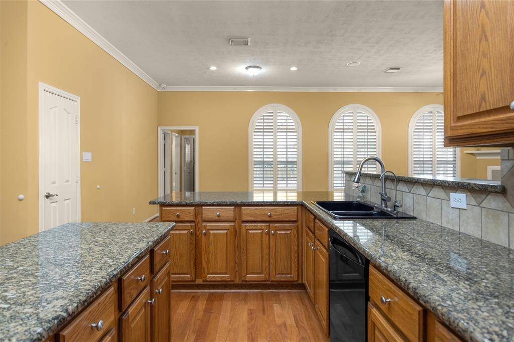 This Kitchen is an entertainers dream with an abundance of countertop space for meal prepping and serving! Plus  plenty of cabinet space for storage!