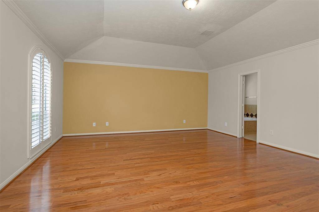 The Primary Suite boasts an Ensuite Full Bath & Walk-In Closet!