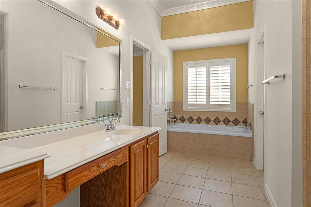 The expansive Primary Bathroom boasts Dual Sinks, Soaking Tub & Linen Closet!