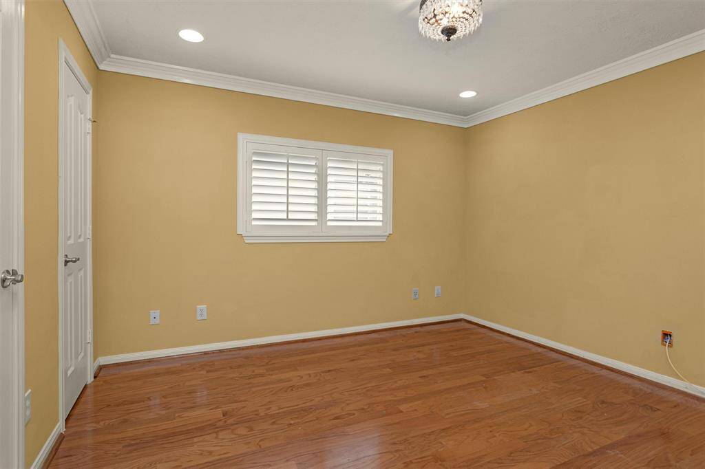 Bedroom #4 features hardwood flooring and decorative chandelier!