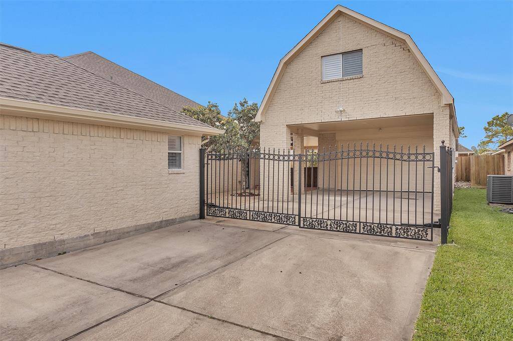 Parking features include a driveway gate, 2-Car Garage and Carport!