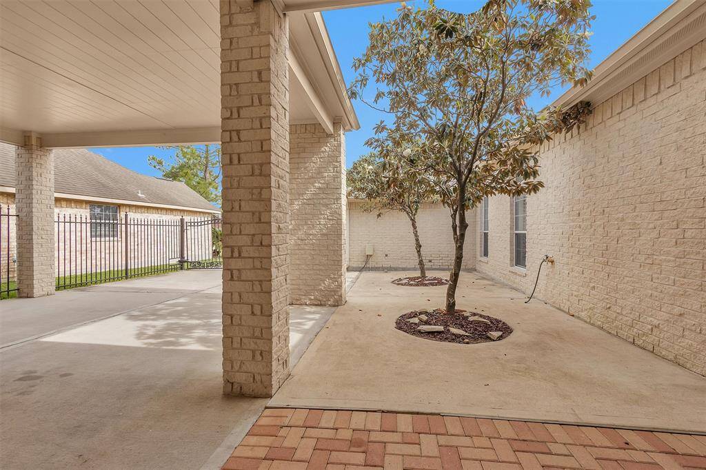 Enjoy the convenience and comfort of a covered walkway leading inside from the Carport and Garage!