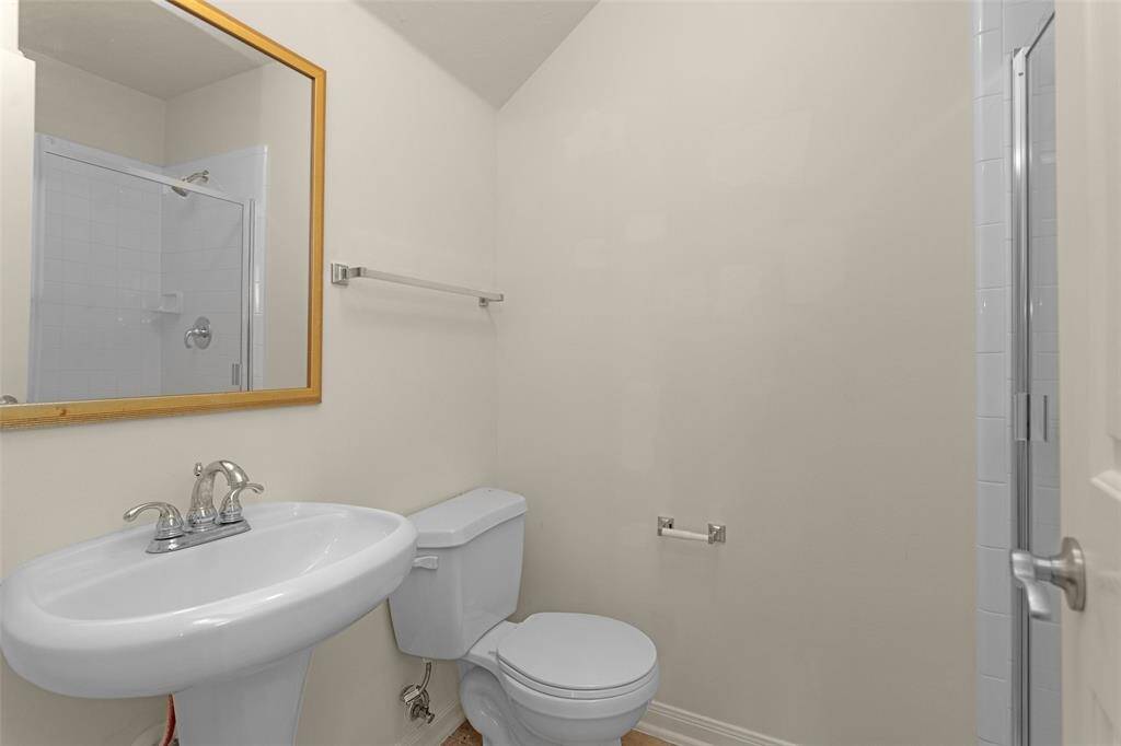 The Garage Apartment Full Bathroom features a Walk-In Shower!