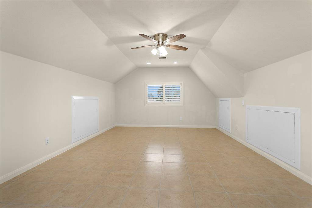 This room features a ceiling fan and window looking toward the Front Yard!